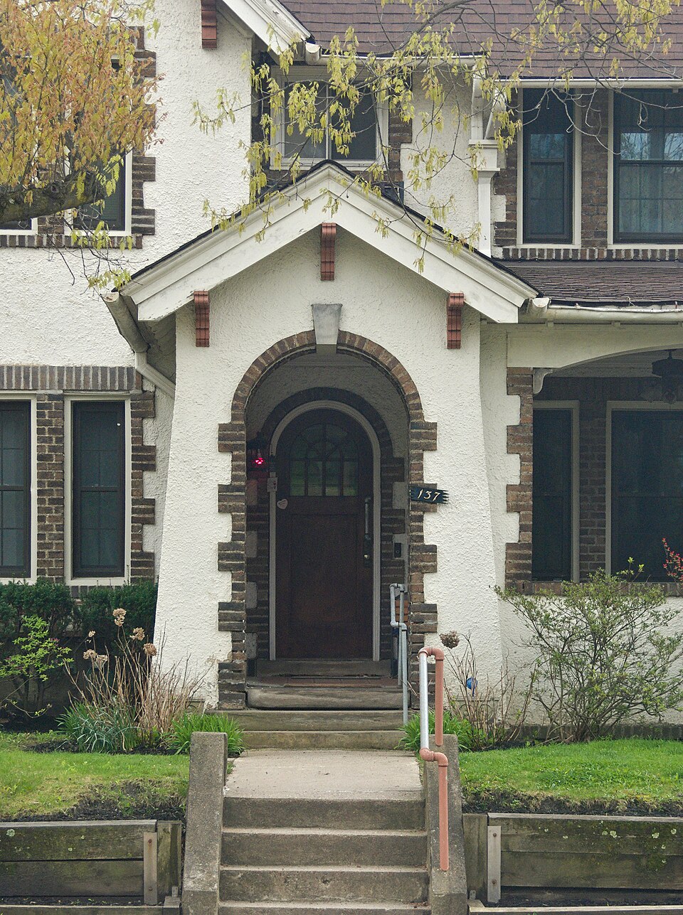Gabled entry porch and steps at a house on Marshall Avenue, Pittsburgh.